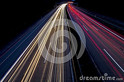 Car lights on road at night