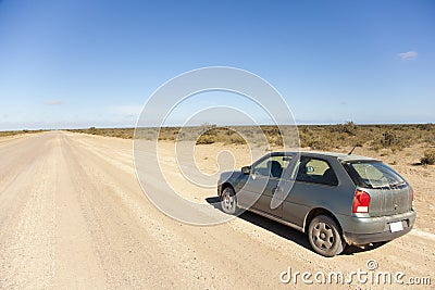Car on an open dusty road