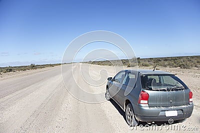 Car on an open dusty road