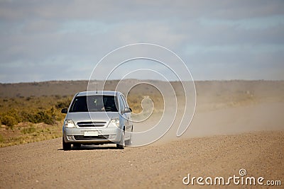 Car on an open dusty road