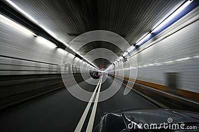 Car speeding and turning tunnel