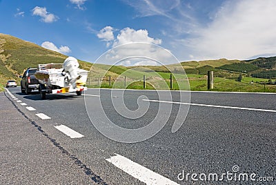 Car towing motor boat