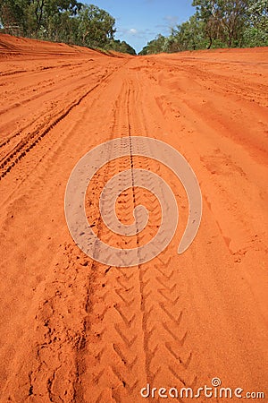 Car tracks in red dirt