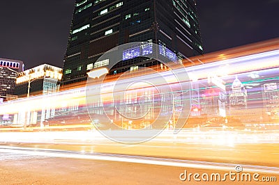 Car traffic at night in front of the 101 Tower