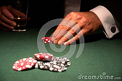 Card player in casino with chips