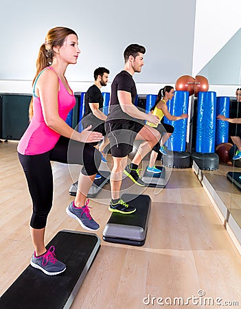 Cardio step dance group at fitness gym training