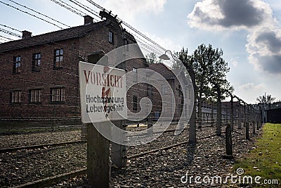 Careful, High-Voltage, Danger sign in Auschwitz II-Birkenau camp in Brzezinka