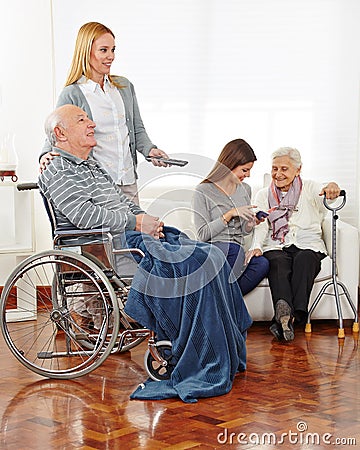 Caregiver entertaining senior