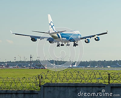 Cargo plane calling on landing at the airport in the evening