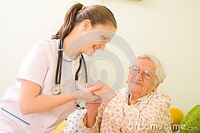 Caring Doctor With Elderly Woman