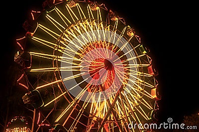 Carnival Ferris Wheel Lit Up At Night