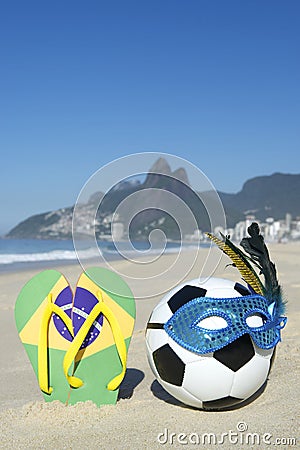 Carnival Mask Soccer Ball Football and Flip Flops on Beach Brazil