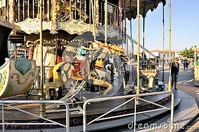 Carousel with wooden horses