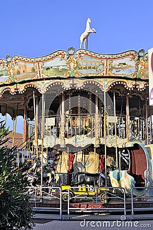 Carousel with wooden horses