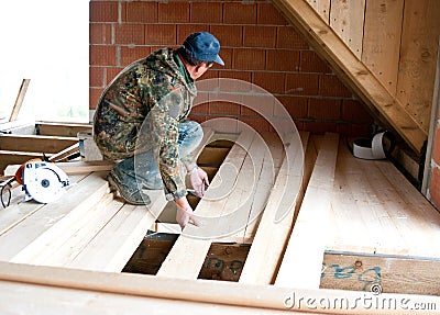 Carpenter building new floor