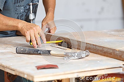 Carpenter cut wood for house construction