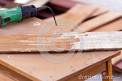 Carpenter drill wood for house construction