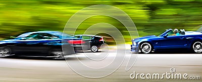 Cars in blurred motion on road. Abstract background.