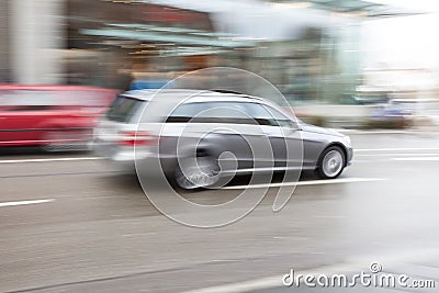 Cars Driving Fast in City