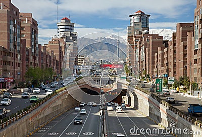 Cars Passing Through Navvab Tunnel of Tehran with Milad Tower in the Background