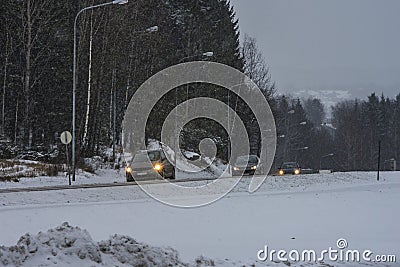 Cars running in the snowy weather