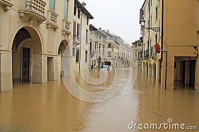 Cars in the streets and roads submerged by the mud of the flood