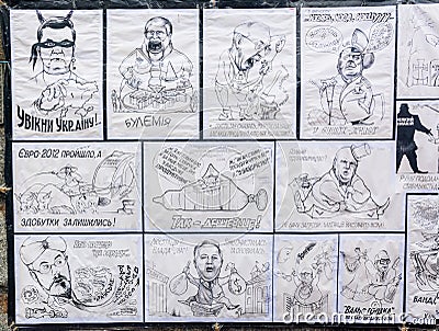 Cartoons of the government officials are seen in opposition camp