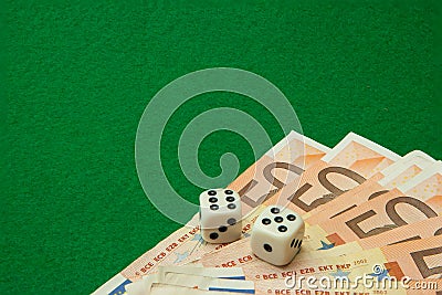 Casino table with euro notes and dice