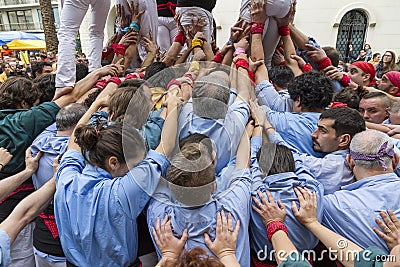 Castellers, arms supporting the tower