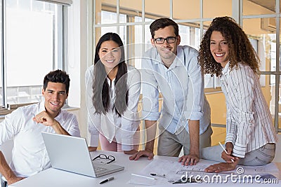 Casual architecture team working together smiling at camera