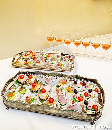 Catering food in silver dishes with wine