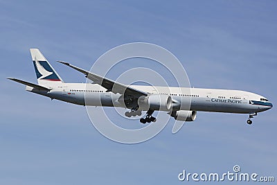 Cathay Pacific Boeing 777 in New York sky before landing at JFK Airport