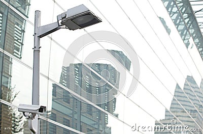 CCTV security camera lamp pole in the city