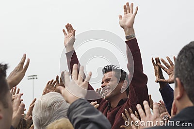 Celebrity Raising Hands For Crowd