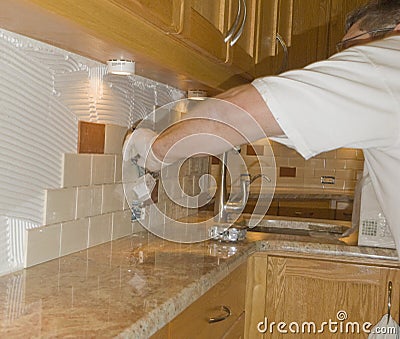 Ceramic tile installation on kitchen backsplash 12