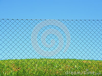 Chain link fence grass sky