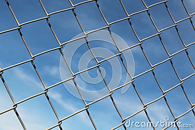 Chain Linked Fence with Blue Sky Background