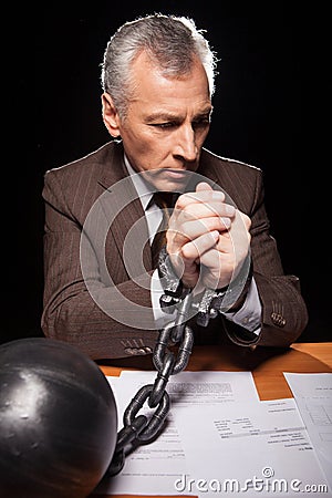 Chained businessman.