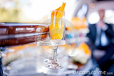 Champagne glass in limousine, wedding day, celebration drinks