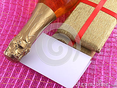 Champagne or wine bottle, blank paper and golden box, New Year or christmas card