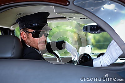 Chauffeur in elegant car