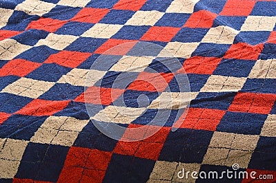 Checkered blue and red fragment of wrinkled cloth as a backgroun