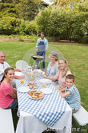 Cheerful extended family having a barbecue