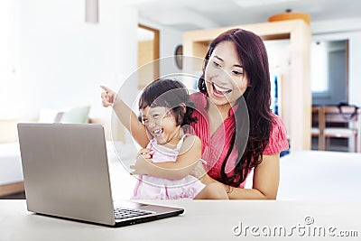 Cheerful family with laptop computer