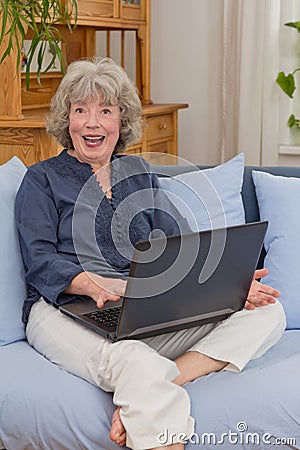 Cheerful senior woman with notebook