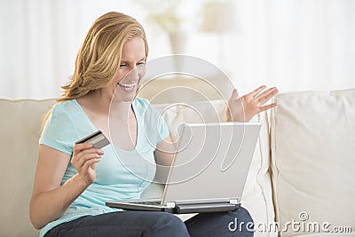 Cheerful Woman Shopping Online At Home