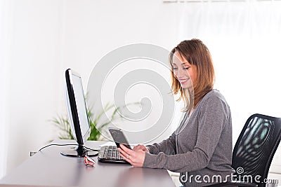 Cheerful young woman relaxed at home with laptop