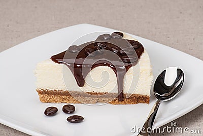 Cheese Cake With Chocolate Sauce On White Plate
