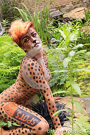 Cheetah Bodypaint Girl In Garden Editorial Pho