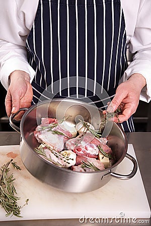 Chef adds thyme to lamb meat